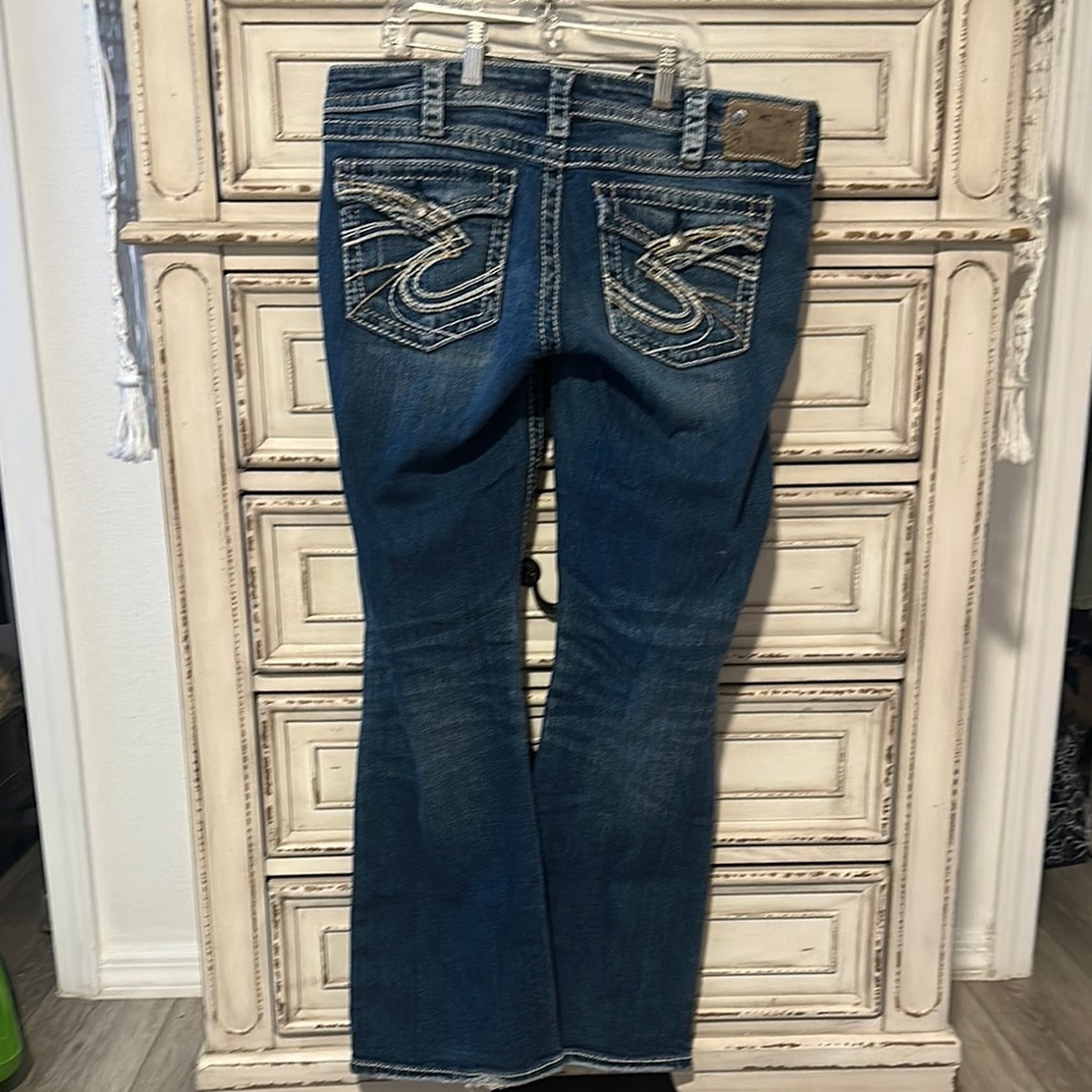 Silver Jeans Blue Boot Cut Denim with Decorative Stitching